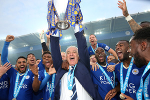 LEICESTER, ENGLAND - MAY 07 : Manager Claudio Ranieri of Leicester City lifts the Premier League trophy after the Barclays Premier League match between Leicester City and Everton at the King Power Stadium on May 7th , 2016 in Leicester, United Kingdom. (Photo by Plumb Images/Leicester City FC via Getty Images)